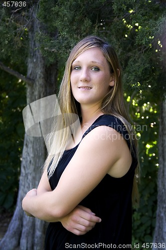 Image of Beautiful Girl in the Park in a Black Dress