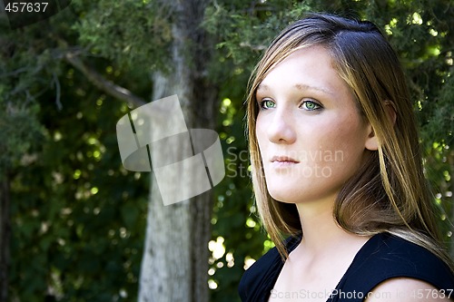 Image of Beautiful Girl in the Park in a Black Dress
