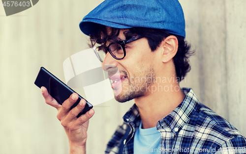 Image of man using voice command or calling on smartphone