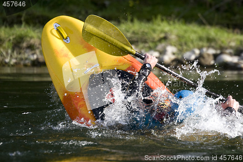 Image of dynamic white water kayak action