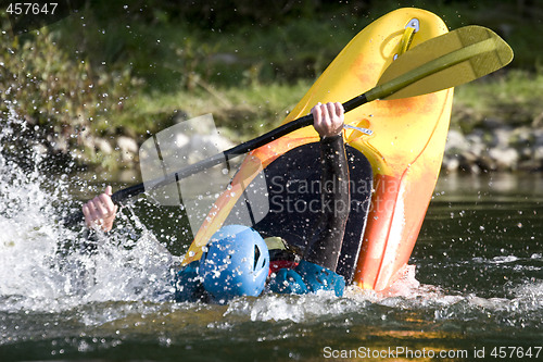 Image of dynamic white water kayak action