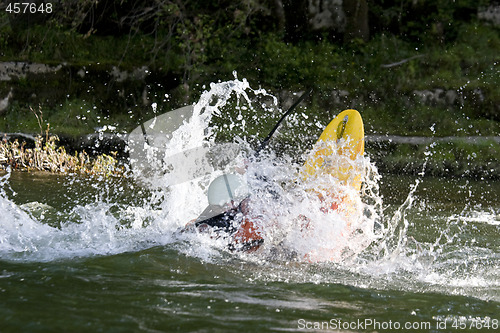 Image of dynamic white water kayak action
