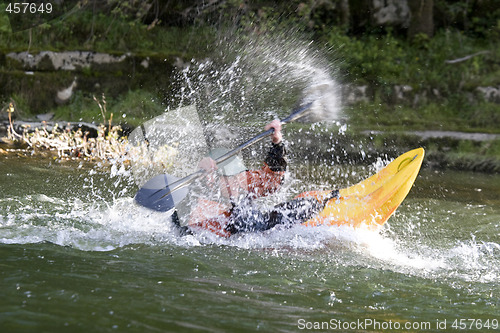 Image of dynamic white water kayak action