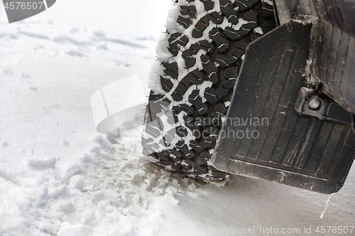 Image of Car tyre in snow