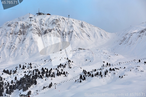 Image of Skiing slopes, majestic Alpine landscape with snow and mountain range