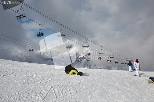 Image of Skiing slopes, with many people