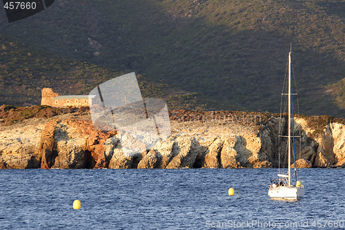Image of sailing yacht at anchor evening Corsica
