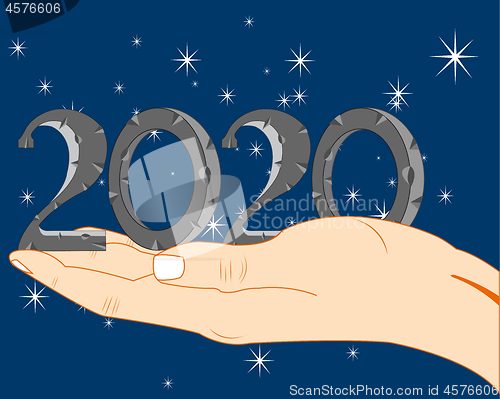 Image of Hand of the person and numerals approaching new year