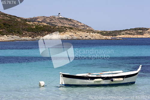 Image of Traditional Corsican fishing boat anchored in bay corsica