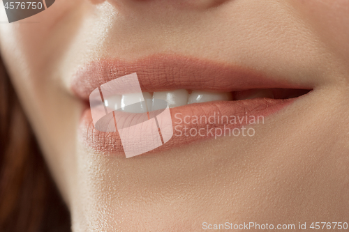 Image of Perfect Lips. Sexy Girl Mouth close up. Beauty young woman Smile.