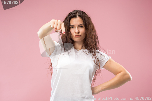 Image of The overbearing business woman point you and want you, half length closeup portrait on pink background.