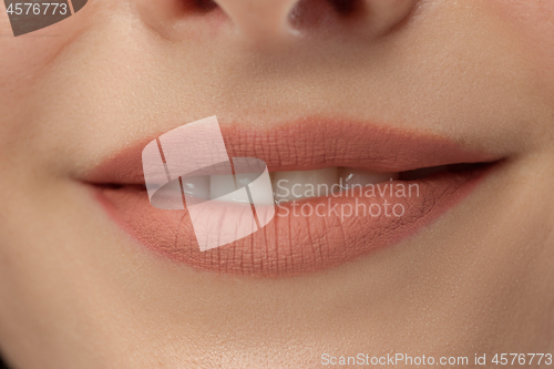 Image of Perfect Lips. Sexy Girl Mouth close up. Beauty young woman Smile.