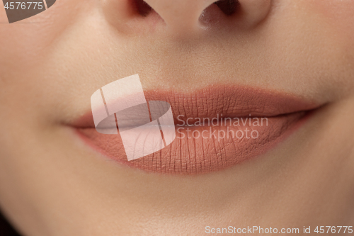 Image of Perfect Lips. Sexy Girl Mouth close up. Beauty young woman Smile.