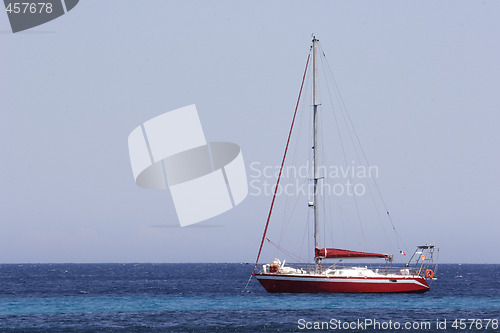 Image of sailing yacht at anchor in bay Corsica