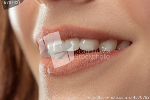 Image of Perfect Lips. Sexy Girl Mouth close up. Beauty young woman Smile.