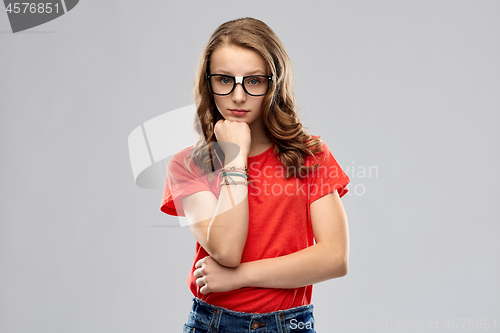 Image of student girl in glasses thinking