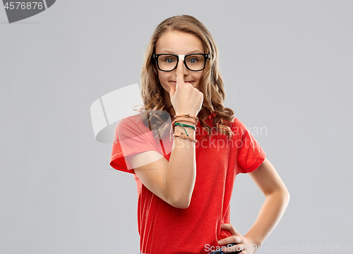 Image of smiling student girl in glasses and red t-shirt