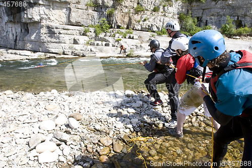 Image of kayak paddlers practising river rescues