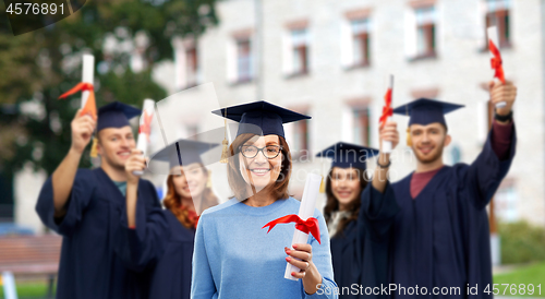 Image of happy senior graduate student woman with diploma