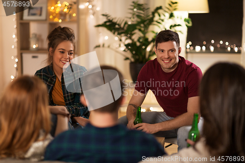 Image of friends drinking non-alcoholic beer at home