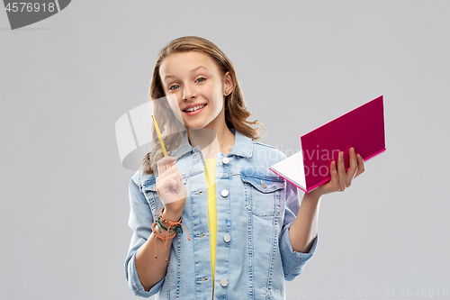 Image of teenage student girl with diary or notebook