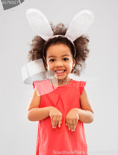 Image of happy little girl wearing easter bunny ears