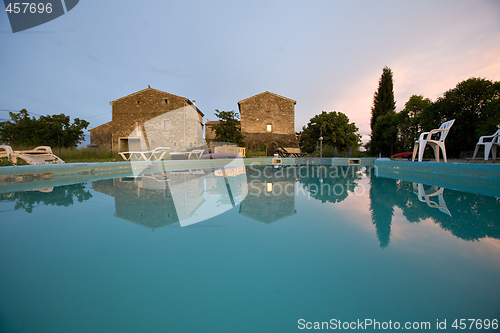 Image of empty swimming pool at sunset france