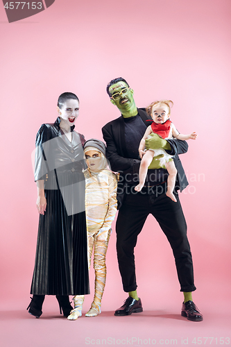 Image of Halloween Family. Happy Father, Mother and Children Girls in Halloween Costume and Makeup