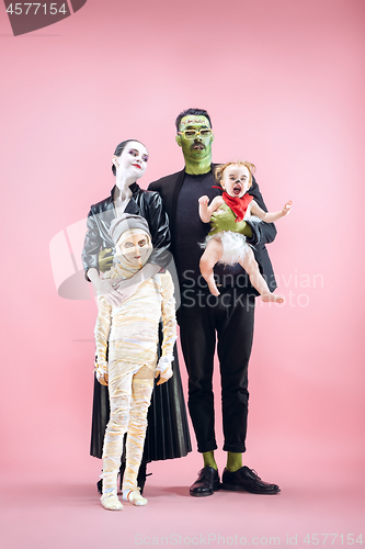 Image of Halloween Family. Happy Father, Mother and Children Girls in Halloween Costume and Makeup