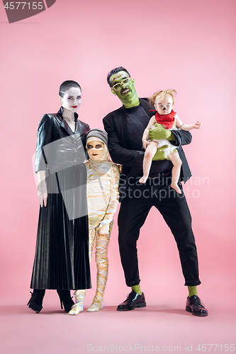 Image of Halloween Family. Happy Father, Mother and Children Girls in Halloween Costume and Makeup