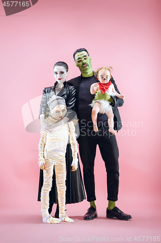 Image of Halloween Family. Happy Father, Mother and Children Girls in Halloween Costume and Makeup