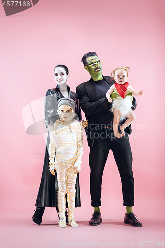 Image of Halloween Family. Happy Father, Mother and Children Girls in Halloween Costume and Makeup