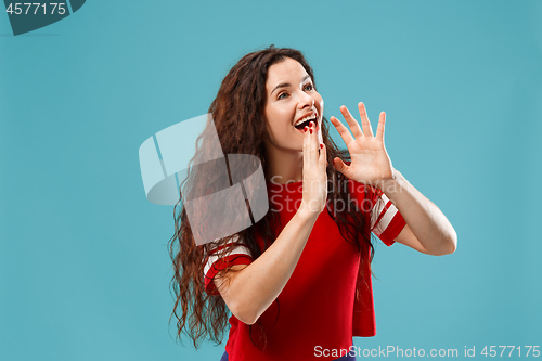 Image of Isolated on pink young casual woman shouting at studio