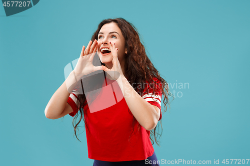 Image of Isolated on pink young casual woman shouting at studio