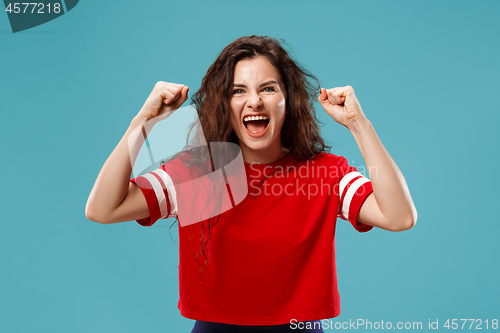 Image of Winning success woman happy ecstatic celebrating being a winner. Dynamic energetic image of female model