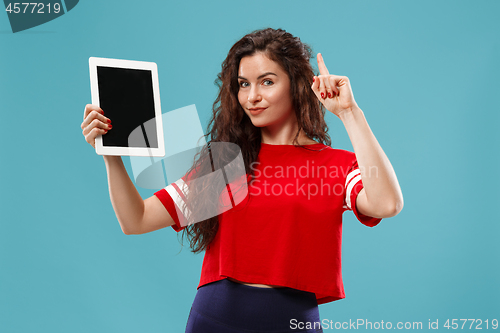 Image of The happy businesswoman with red laptop on blue