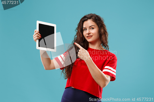 Image of The happy businesswoman with red laptop on blue