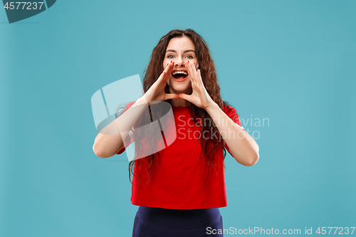 Image of Isolated on pink young casual woman shouting at studio