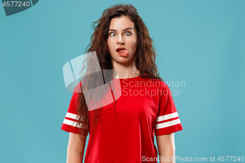 Image of Beautiful woman in stress isolated on blue