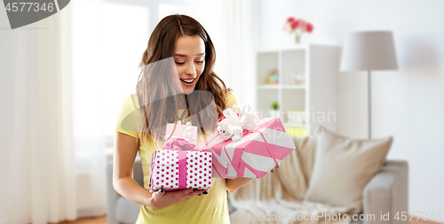 Image of young woman or teenage girl with birthday gifts