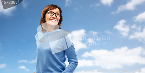 Image of portrait of senior woman in glasses over grey