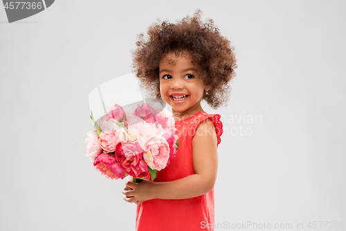 Image of happy little african american girl with flowers