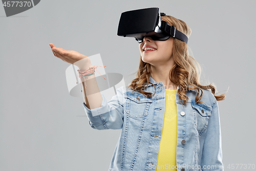 Image of teen girl in virtual reality headset or vr glasses