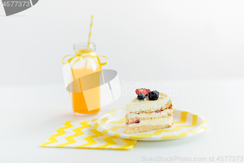 Image of piece of berry layer cake on disposable plate