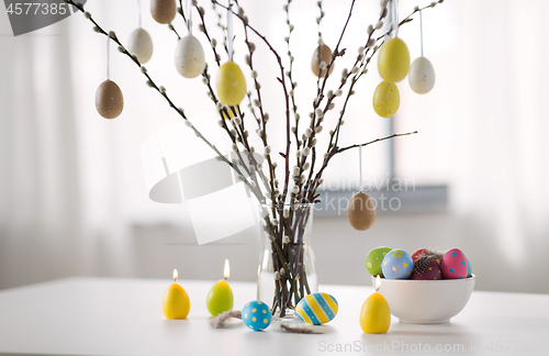 Image of pussy willow branches decorated by easter eggs