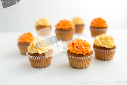 Image of cupcakes with frosting on white background