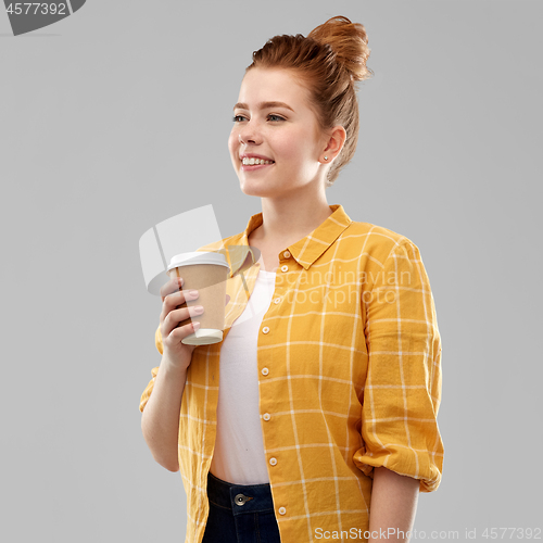 Image of happy redhead teenage girl with paper coffee cup