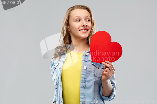 Image of smiling teenage girl with red heart