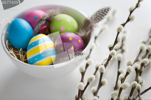 Image of colored easter eggs and pussy willow branches