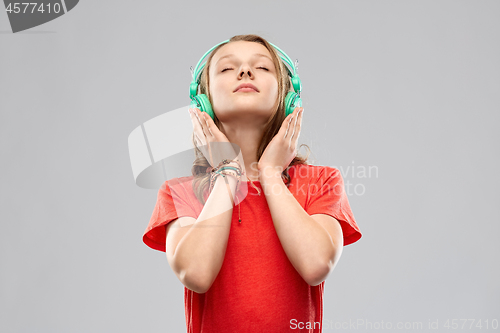 Image of happy teenage girl with headphones